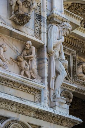 6 JUNE 2018, MILAN, ITALY: Sculptures of saints and martyrs decorating the Cathedral of Milan (Duomo di Milano) are shot closeup.のeditorial素材