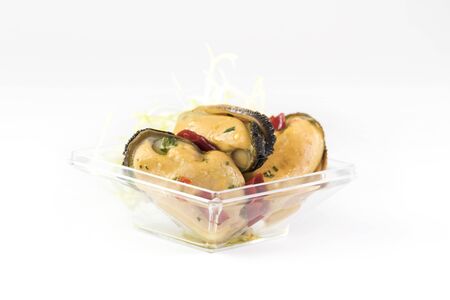 Mini snacks for buffet and banquet in a plastic bowl on a white background.