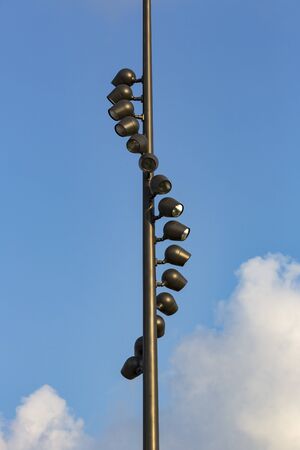 Street lights shot close up against the sky.の写真素材