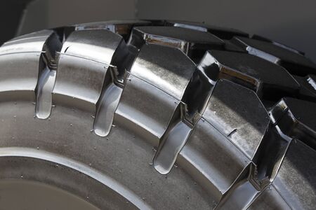The texture of the treads of a rubber wheel shot close-up