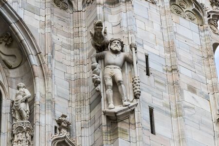 6 JUNE 2018, MILAN, ITALY: Sculptures of saints and martyrs decorating the Cathedral of Milan (Duomo di Milano) are shot closeup.のeditorial素材
