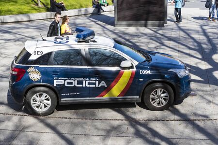 MADRID, SPAIN - MARCH 27, 2018: Police on the streets of the city watching the orderのeditorial素材