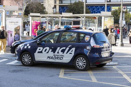 MADRID, SPAIN - MARCH 27, 2018: Police on the streets of the city watching the orderのeditorial素材