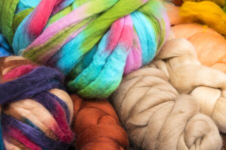 Background colored braids threads filmed close-up.