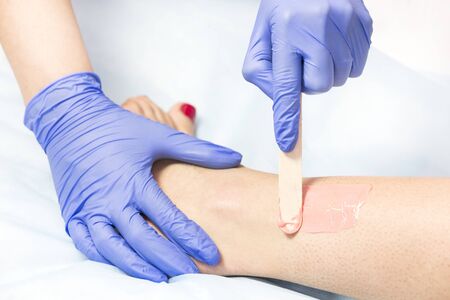 Depilation of female body parts in a beauty salon.の写真素材