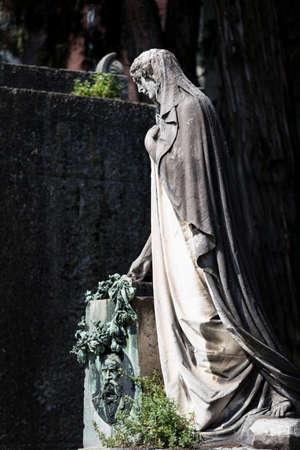 MILAN, ITALY - JUNE 6, 2018: Statues of mourning in Milan.のeditorial素材