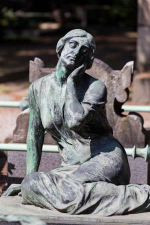 MILAN, ITALY - JUNE 6, 2018: Statues of mourning in Milan.のeditorial素材