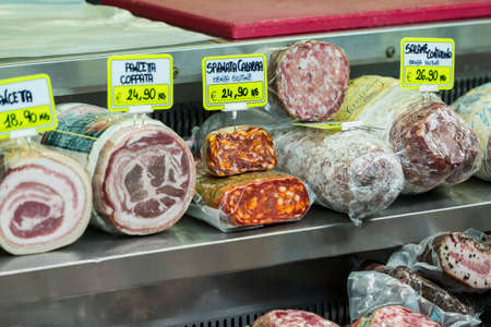 7 JUNE 2018, MILAN, ITALY: Showcases and shelves of the Wagner Market in Milan with many kinds of cheeses.のeditorial素材