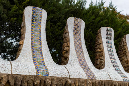 BARCELONA, SPAIN - JANUARY 13, 2018: Elements of mosaic fragments mosaic work in Park Guell In...
