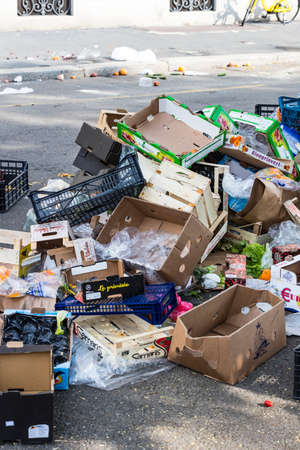 2 JUNE 2018, MILAN, ITALY: Garbage remains on the street at the site of the street market in the...