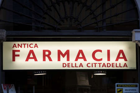 4 JUNE 2018, MILAN, ITALY: Signs of pharmacies on the streets of Milan. In Italy.のeditorial素材