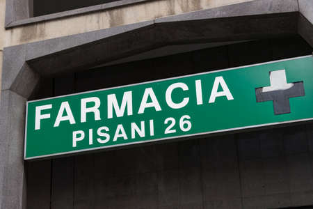 4 JUNE 2018, MILAN, ITALY: Signs of pharmacies on the streets of Milan. In Italy.のeditorial素材