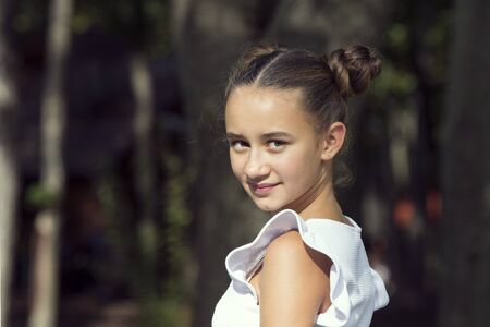 portrait of a young girl in a summer park.の写真素材