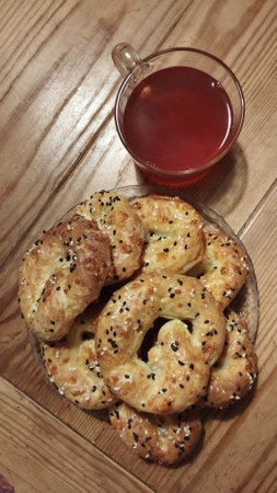 home-made fresh cottage cheese bagels with cheese and black and light sesame seeds on a plate and...