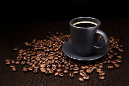 Cup of coffee in coffee beansの写真素材