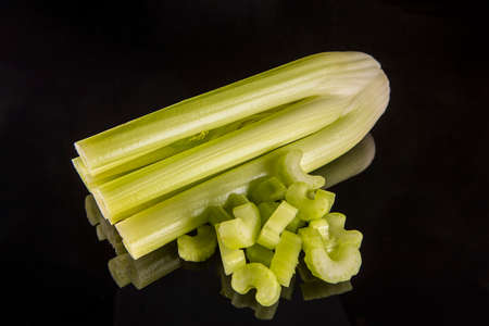 Fresh celery on black background
