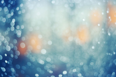 Festive abstract light blue background with golden and silver bokeh lights. Christmas and New Year holidays background.の素材