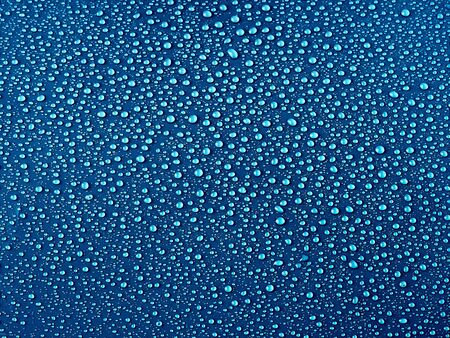 Water drops on blue background.の写真素材