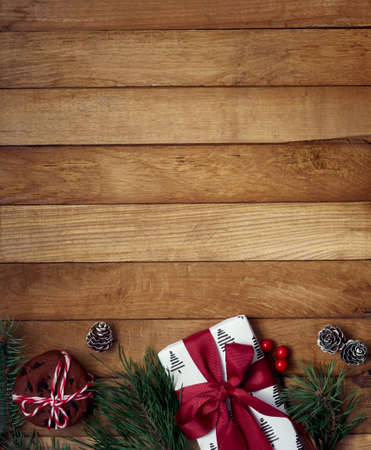 Christmas gifts with christmas decoration on wooden background.の写真素材