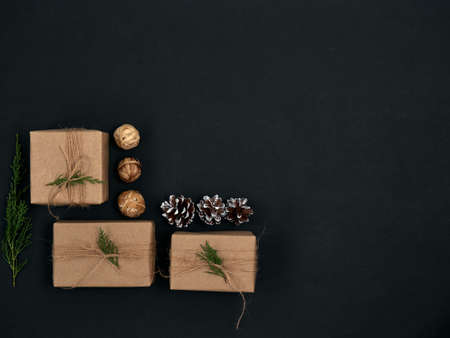 Christmas gifts with christmas decoration on black background.