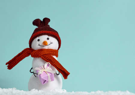 Christmas background with toy snowman.の写真素材