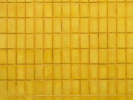 Background of yellow tile wall.の写真素材