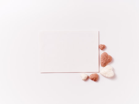 Postcard with handmade craft heartson white backgroundの写真素材