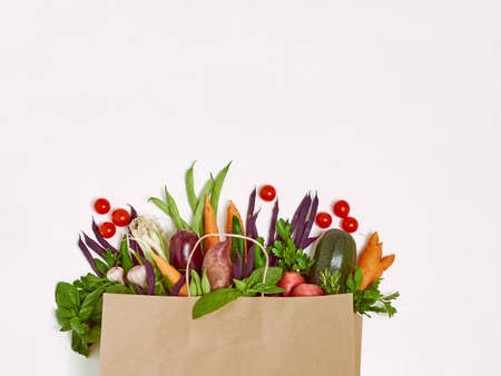 Frame of various isolated vegetables on white background, top view. Frame of organic food with space...