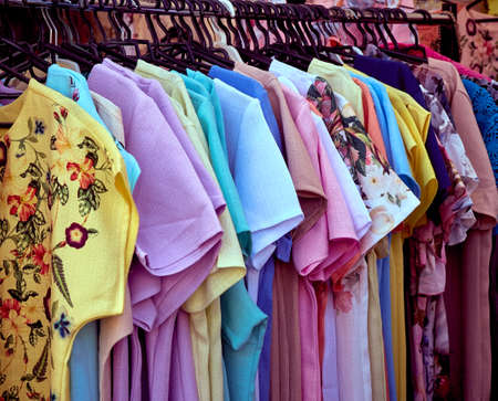 Woman clothes on hangers for sale.の写真素材
