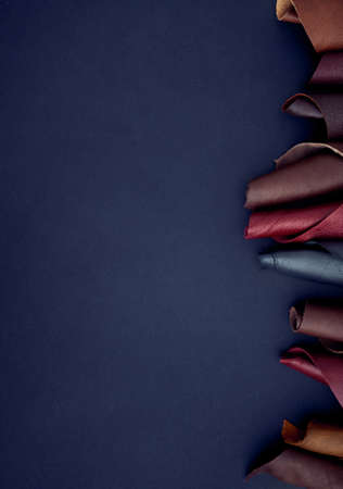 Swatch of leather textile in various colors on dark backgroundの写真素材
