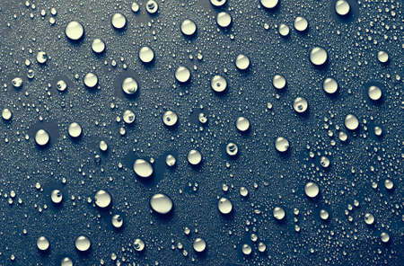 Water drops on blue background.の写真素材