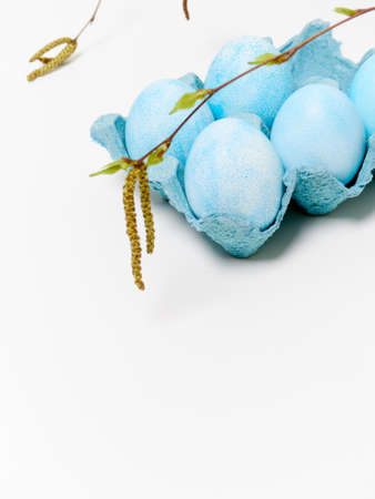 Easter eggs in a carton box on a white background.の写真素材