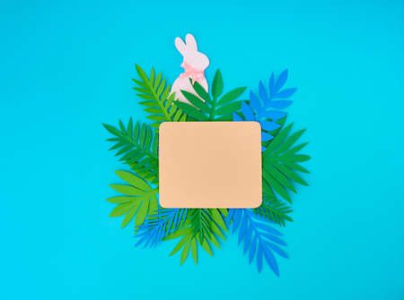 Easter greeting card. Paper blank on blue background. Flat lay, top view, copy space.の写真素材