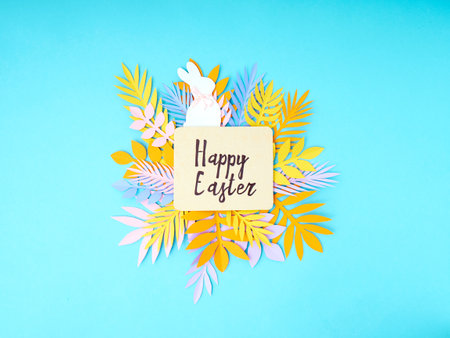 Easter greeting card. Paper blank on blue background. Flat lay, top view.の写真素材