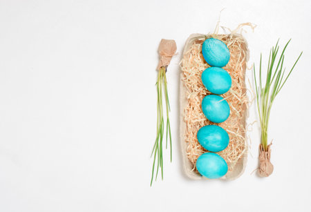 Easter eggs in a carton box on a white background.の写真素材