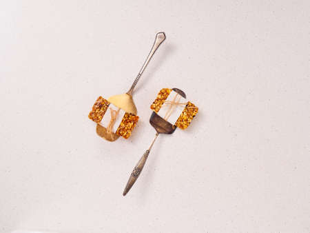 Granola bar and ingredients on a white stone table.Top view.の写真素材