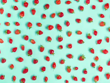 Fresh strawberry pattern on turquoise background.の写真素材