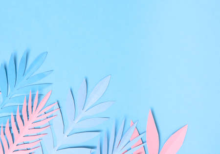 Summer background with colorful paper tropical leaves.の写真素材