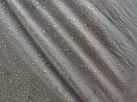 Water drops on waterproof membrane fabric. Morning dew on tent.の写真素材
