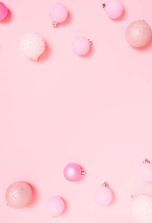 Top view of Christmas composition on pastel pink background. Holiday greeting card with copy space to text.の写真素材