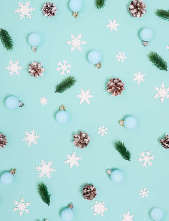 Christmas pattern. New Year decorations on blue background. Spruce, cones and Ñhristmas decorations. Flat lay, top view.の写真素材