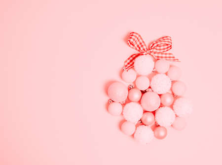 Top view of Christmas composition on pastel pink background. Holiday greeting card with copy space to text.の写真素材