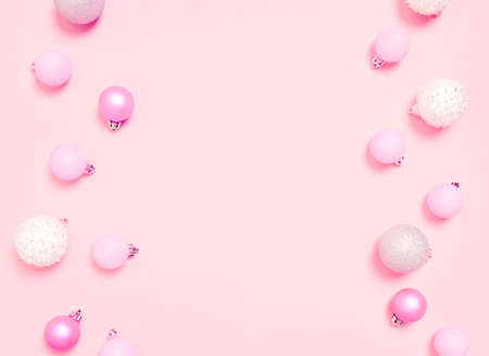 Top view of Christmas composition on pastel pink background. Holiday greeting card with copy space to text.の写真素材