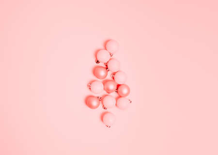 Top view of Christmas composition on pastel pink background. Holiday greeting card with copy space to text.の写真素材