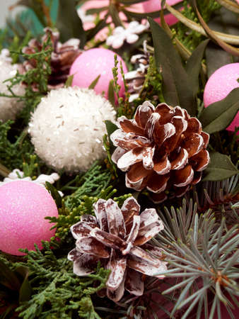 Details of Christmas wreath of fresh spruce, cones and Ñhristmas decorations, close up. New Year decorations.の写真素材