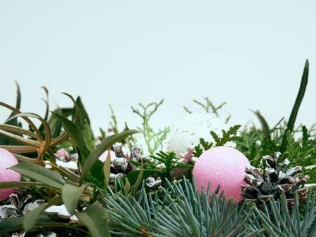 Details of Christmas wreath of fresh spruce, cones and Ñhristmas decorations, close up. New Year decorations.の写真素材