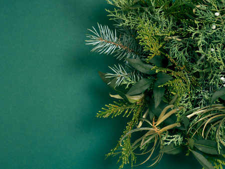 Top view of Christmas composition on green background. Holiday greeting card.の写真素材
