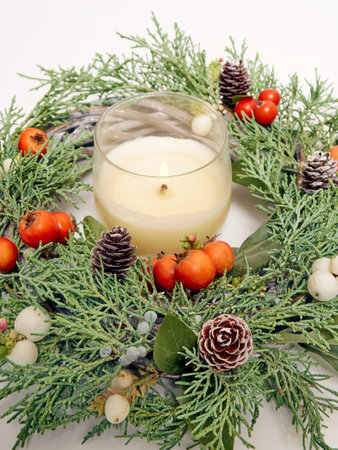 Details of Christmas wreath of fresh spruce, cones and Ñhristmas decorations, close up. New Year decorations.の写真素材