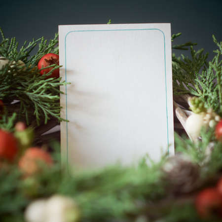 Details of Christmas wreath of fresh spruce, cones and Ñhristmas decorations, close up. New Year...