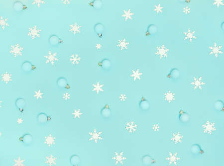 Christmas pattern. New Year decorations on blue background. Snowflakes, Ñhristmas decorations. Flat lay, top view.の写真素材